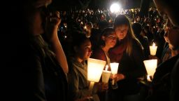 Community members attend a candlelight vigil at Stewart Park for those killed during a shooting at Umpqua Community College in Roseburg, Oregon, on Thursday, October 1.