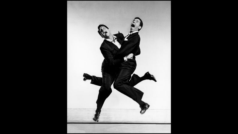 Dean Martin and Jerry Lewis were America's leading comedy act until their split in 1956. The two were known for Lewis' manic slapstick and straight-man Martin's smooth crooning. Halsman captures their energy and their wit in this jumping photo.