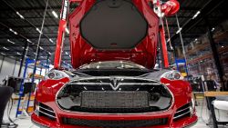 A view of a fully electric Tesla car on an assembly line at the new Tesla Motors car factory in Tilburg, the Netherlands, during the opening and launch of the new factory, on August 22, 2013. The American electric car manufacturer Tesla Motors, led by American-South African inventor and entrepreneur Elon Musk, will be assembling fully electric cars for the European market in this new factory. AFP PHOTO / ANP / GUUS SCHOONEWILLE   ***Netherlands out***        (Photo credit should read Guus Schoonewille/AFP/Getty Images)