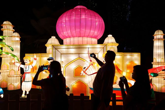 Visitors admire handcrafted lantern decorations during Mid-Autumn Festival celebrations. The event is also sometimes known as Lantern Festival in Singapore and Malaysia. 