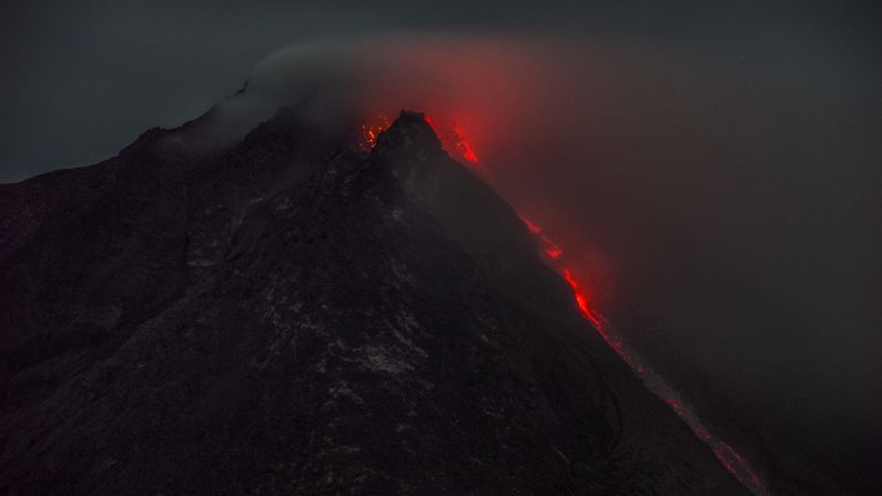 Volcanic activity continues at Indonesia's Mount Sinabung, with this eruption being captured on September 28. More than 10,000 people's lives have been disrupted by forced evacuation.