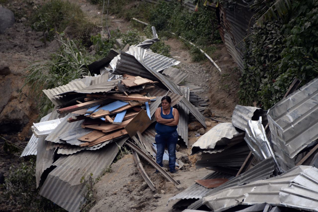 A woman stands in the midst of the debris on October 2. 