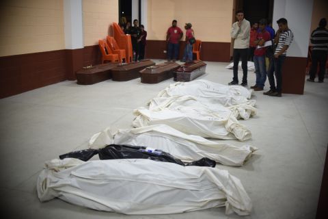 Bodies recovered from the debris are seen at a provisional morgue in Santa Catarina Pinula municipality on October 2. 