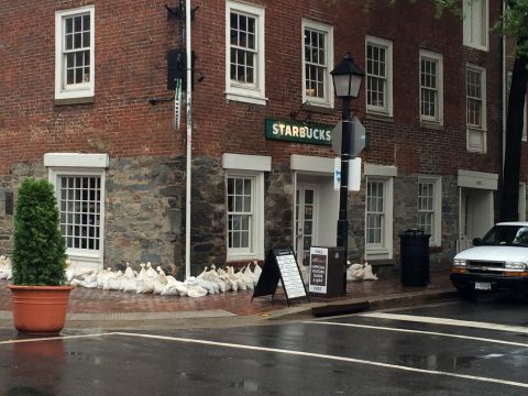 Sandbags surround a building in Old Town Alexandria, Virginia.