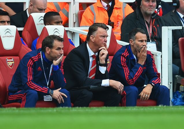 Louis van Gaal and his coaching team looks on in dismay as his team slid to a heavy defeat against Arsenal. 