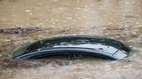 The roof of a submerged vehicle peeks above the flood waters on October 4 in Columbia, South Carolina. 