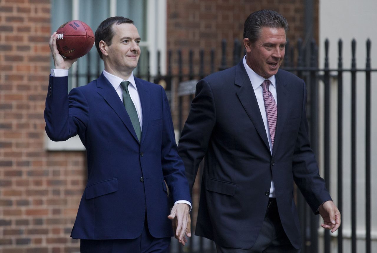 Britain's Finance Minister George Osborne throws an American football after meeting NFL legend Dan Marino in Downing Street. Osborne believes an NFL franchise could be operating in London in the next five years. 