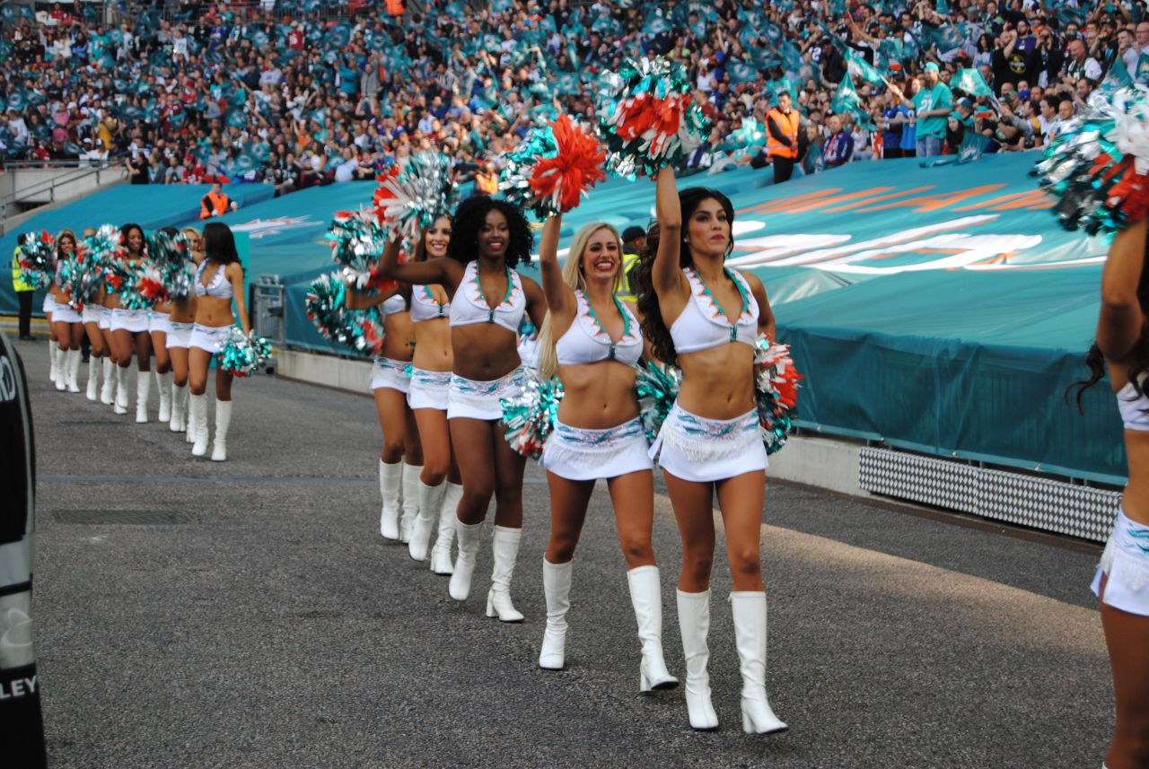 Miami Dolphins cheerleaders strut their stuff at a packed Wembley Stadium.