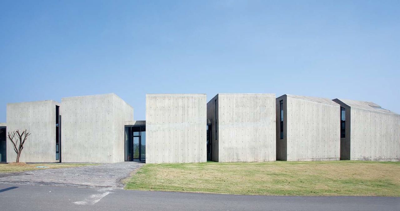 Billionaire Chinese buisnessman Lu Jun asked twenty of the world's leading architects and artists to design buildings for his Sifang Art Park. These six concrete blocks were designed by Chinese dissident artist, Ai Weiwei.