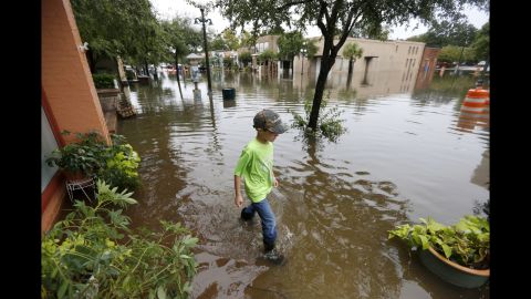 Tripp Adams, 8, walks through flood waters in Georgetown, South Carolina, on October 4.