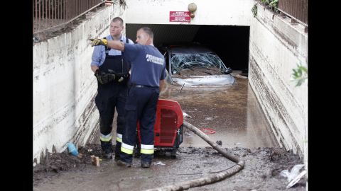 Rescue workers pump water out of a garage in Mandelieu-la-Napoule, France, on Monday, October 5. Rainfall on an "exceptional scale" set off flash floods that have wreaked havoc along France's southeastern coast. At least 19 people are dead.