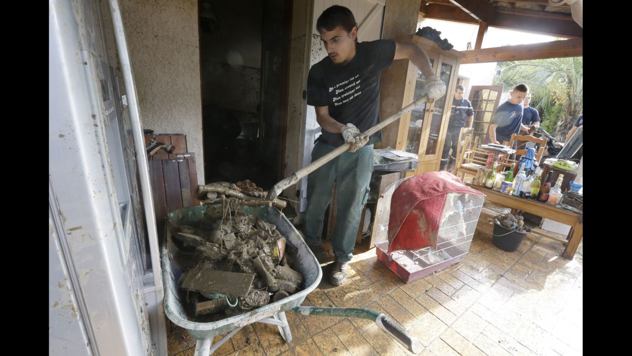 A man cleans a house in Biot, France, on October 5.