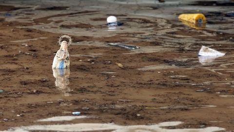 A statue of the Virgin Mary stands in water at the entrance of an underground parking garage in Mandelieu-la-Napoule on October 4.