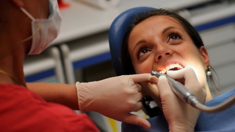 A dentist treats a patient in Bailleul, northern France.