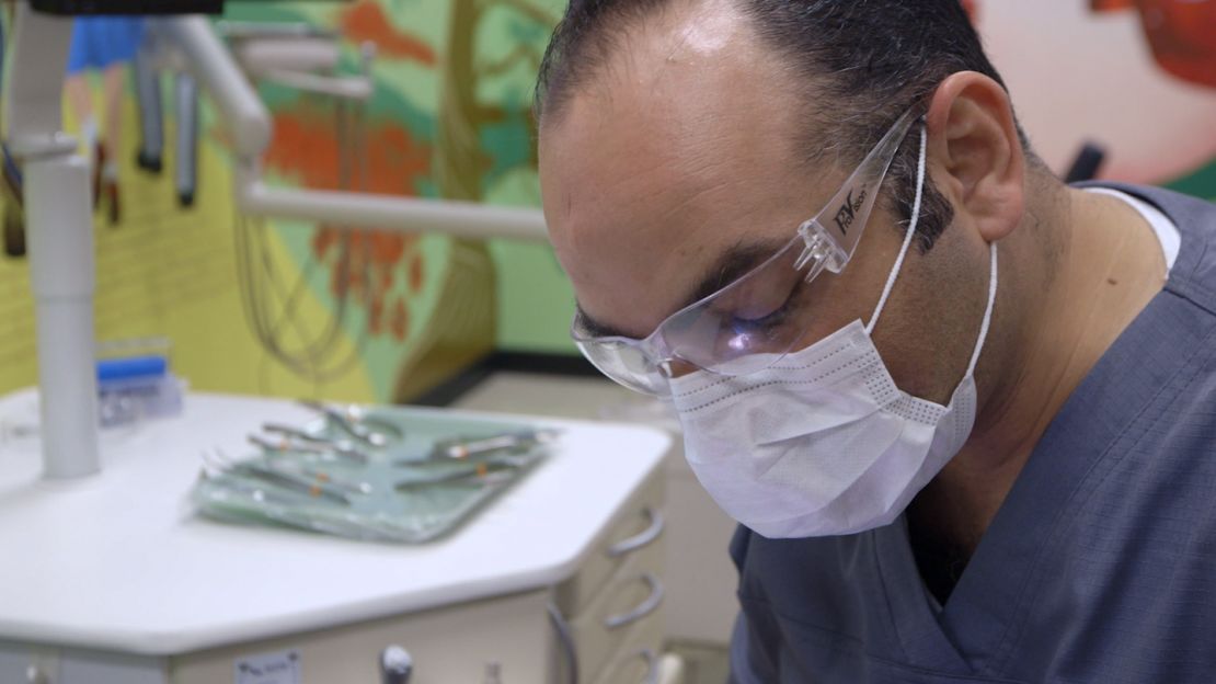 Ahmad Keichour works as a dental assistant, earning far less than he did as a dentist in Syria.