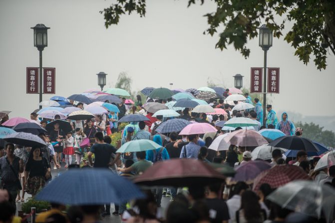 Tourists pack a bridge on Hangzhou's West Lake on October 4. A UNESCO World Heritage Site famous for being a source of inspiration for poets, scholars and artists since ancient times, West Lake is China's most crowded tourist site during the holiday, according to CCTV.