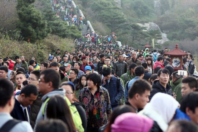 Tourists visit Mount Tai, one of China's five sacred mountains and a UNESCO world heritage site, on October 4 in Tai'an, Shandong. 