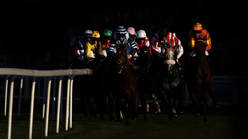 Horses turn into the back straightaway at the Ascot Racecourse in Ascot, England, on Friday, October 2.