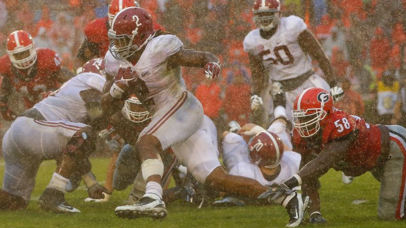 Alabama running back Derrick Henry breaks a tackle at Georgia on Saturday, October 3. Henry had 148 yards rushing as the Crimson Tide rolled to a 38-10 victory.