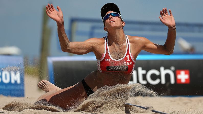 Canadian beach volleyball player Jamie Lynn Broder dives into the sand as she plays a shot Thursday, October 1, at the World Tour event in Fort Lauderdale, Florida.