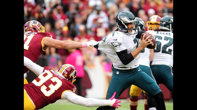 Washington's Ryan Kerrigan and Trent Murphy corral Philadelphia quarterback Sam Bradford during their 23-20 home victory on Sunday, October 4.