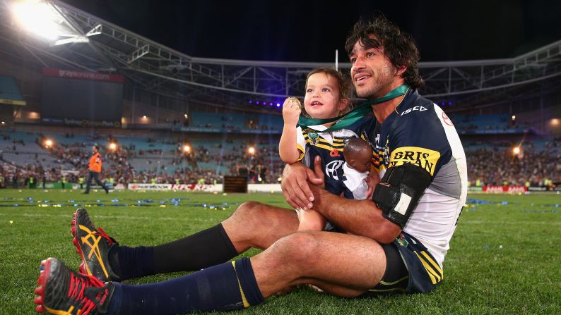 Johnathan Thurston, captain of the North Queensland Cowboys, holds his daughter, Frankie, after his team won the National Rugby League's grand final Sunday, October 4, in Sydney. Images of the two <a href="index.php?page=&url=http%3A%2F%2Fwww.bbc.com%2Fnews%2Fworld-australia-34440600" target="_blank" target="_blank">went viral on social media</a> after people noted Frankie's dark-skinned doll.