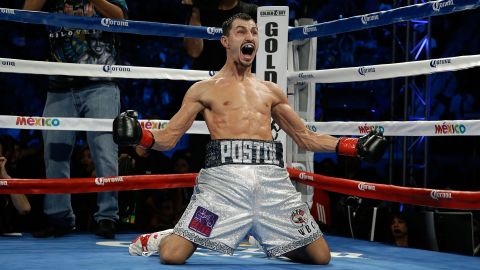 Viktor Postol celebrates his knockout victory over Lucas Matthysse, which came in the 10th round Saturday, October 3, in Carson, California. The two were fighting for the WBC's vacant title in the 140-pound weight class.