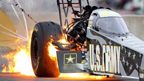 Flames fly from the car of drag racer Tony Schumacher during the Keystone Nationals event in Mohnton, Pennsylvania, on Sunday, October 4. It is common to see fire under drag racing vehicles as their engines are pushed to the limit.