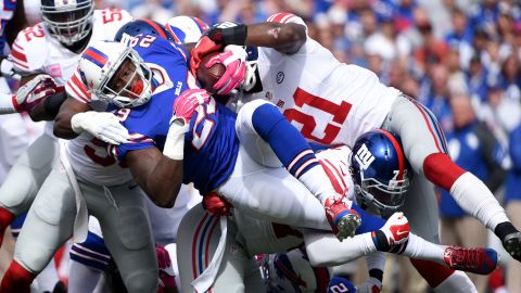Buffalo Bills running back Karlos Williams is tackled by New York Giants during an NFL game Sunday, October 4, in Buffalo, New York. The Giants stifled the Bills' offense for a 24-10 victory.
