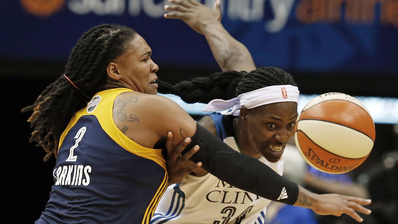 Indiana's Erlana Larkins, left, guards Minnesota's Sylvia Fowles during Game 1 of the WNBA Finals on Sunday, October 4. Indiana won 75-69 to take a 1-0 lead in the best-of-five series.