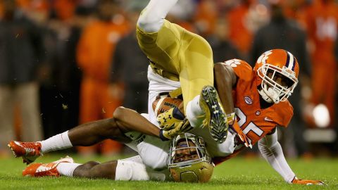 Clemson's Cordrea Tankersley, right, tackles Notre Dame's Corey Robinson during a college football game in Clemson, South Carolina, on Saturday, October 3.