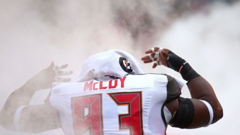 Tampa Bay defensive tackle Gerald McCoy runs onto the field before an NFL game in Tampa, Florida, on Sunday, October 4.