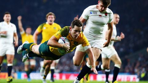 Australia's Bernard Foley scores a try against England during their Rugby World Cup match in London on Saturday, October 3. Australia smashed the host nation 33-13 to advance to the quarterfinals. England was eliminated.