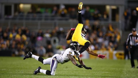 Baltimore's Lardarius Webb upends Pittsburgh's Darrius Heyward-Bey during an NFL game in Pittsburgh on Thursday, October 1.
