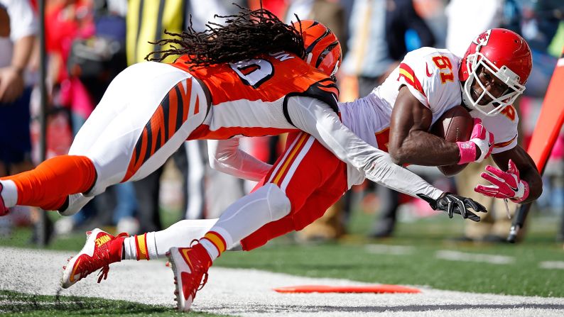 Cincinnati safety Reggie Nelson knocks Kansas City's Jason Avant out of bounds during an NFL game in Cincinnati on Sunday, October 4.