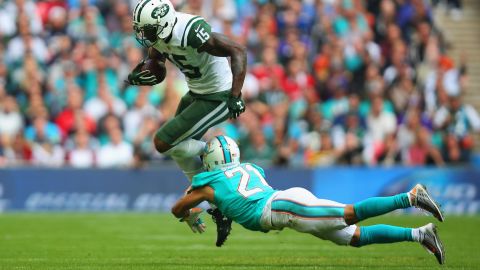 New York Jets wide receiver Brandon Marshall is tackled by Miami's Brent Grimes during an NFL game in London on Sunday, October 4. The NFL has been holding some regular-season games in London since 2007.