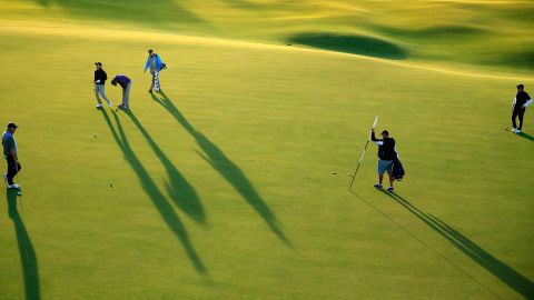 Amateur players finish their round while practicing Tuesday, September 29, at the Alfred Dunhill Links Championship in St. Andrews, Scotland.