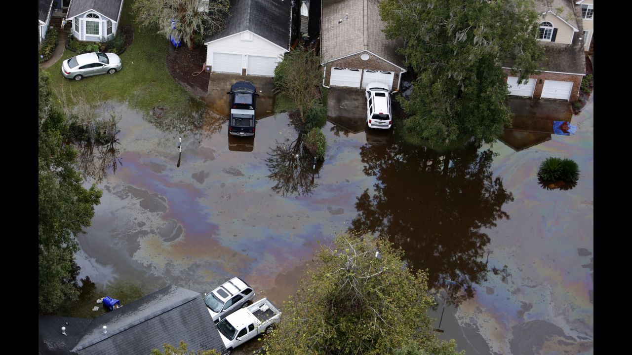 An oil sheen floats atop floodwater in a subdivision west of the Ashley River in Charleston, South Carolina, on October 5. 