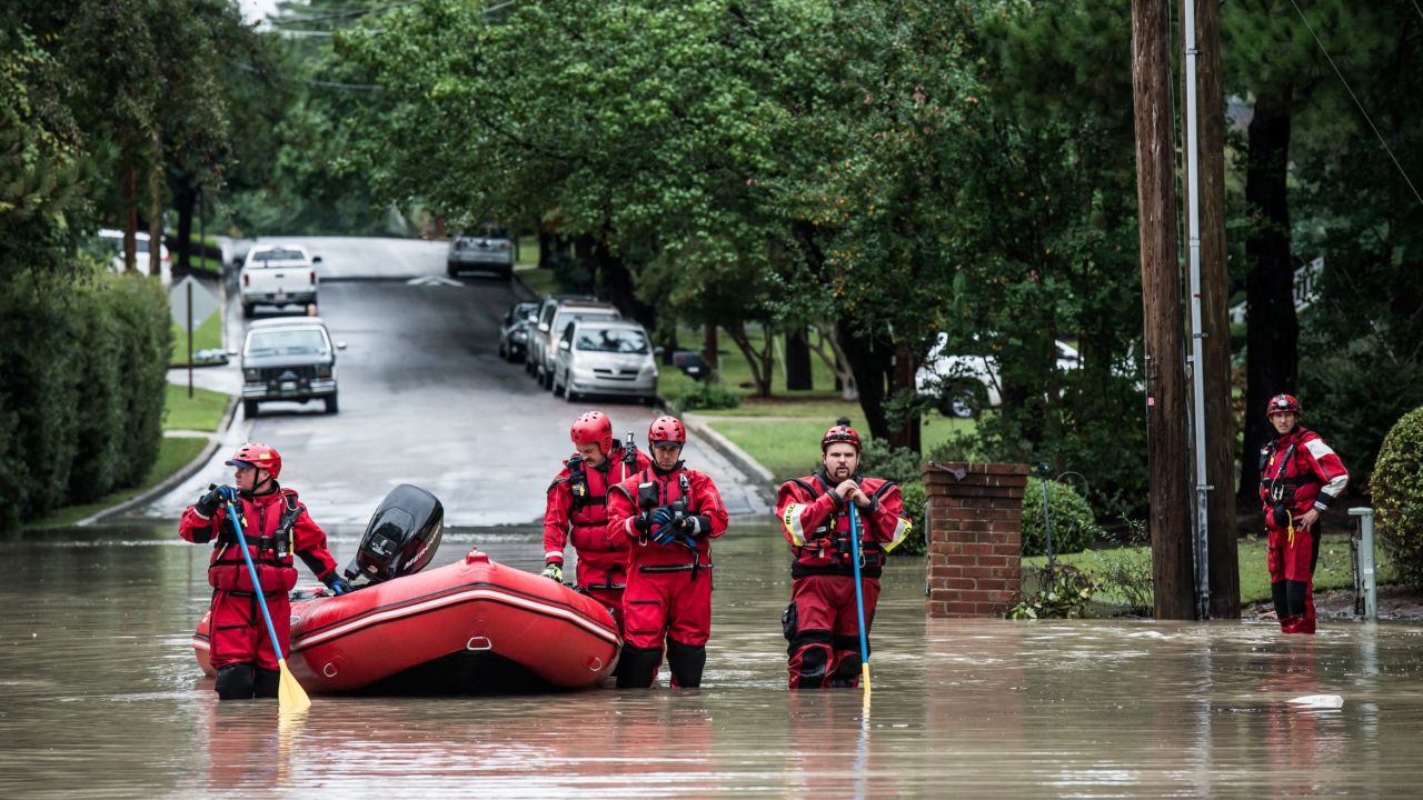 COLUMBIA, SC - OCTOBER 5:   Emergency rescue teams wait for an emergency vehicle in the Forest Acres neighborhood October 5, 2015 in Columbia, South Carolina. The state of South Carolina experienced record rainfall amounts over the weekend which stranded motorists and residents and forced hundreds of evacuations and rescues.  (Photo by Sean Rayford/Getty Images)