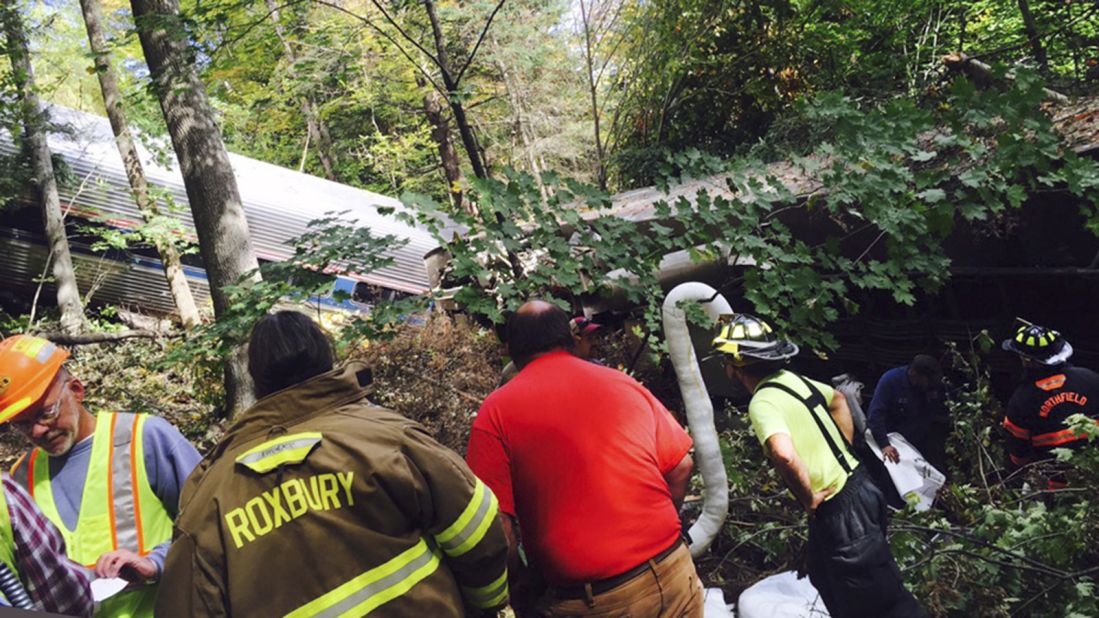 First responders assess the scene of the derailment. 