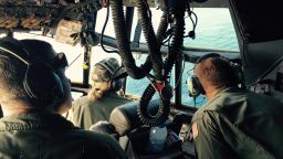 From left, Petty Officer 1st Class Jim Fielder, the plane's engineer, Lt. Heather Majeska, a copilot, and Petty Officer 3rd Class Anders Forsberg, who operated the plane's communications, search for debris. Despite the wealth of technology involved in the search for El Faro survivors, eyes are still one of the most important tools in the search, and everyone is expected to keep a look out.