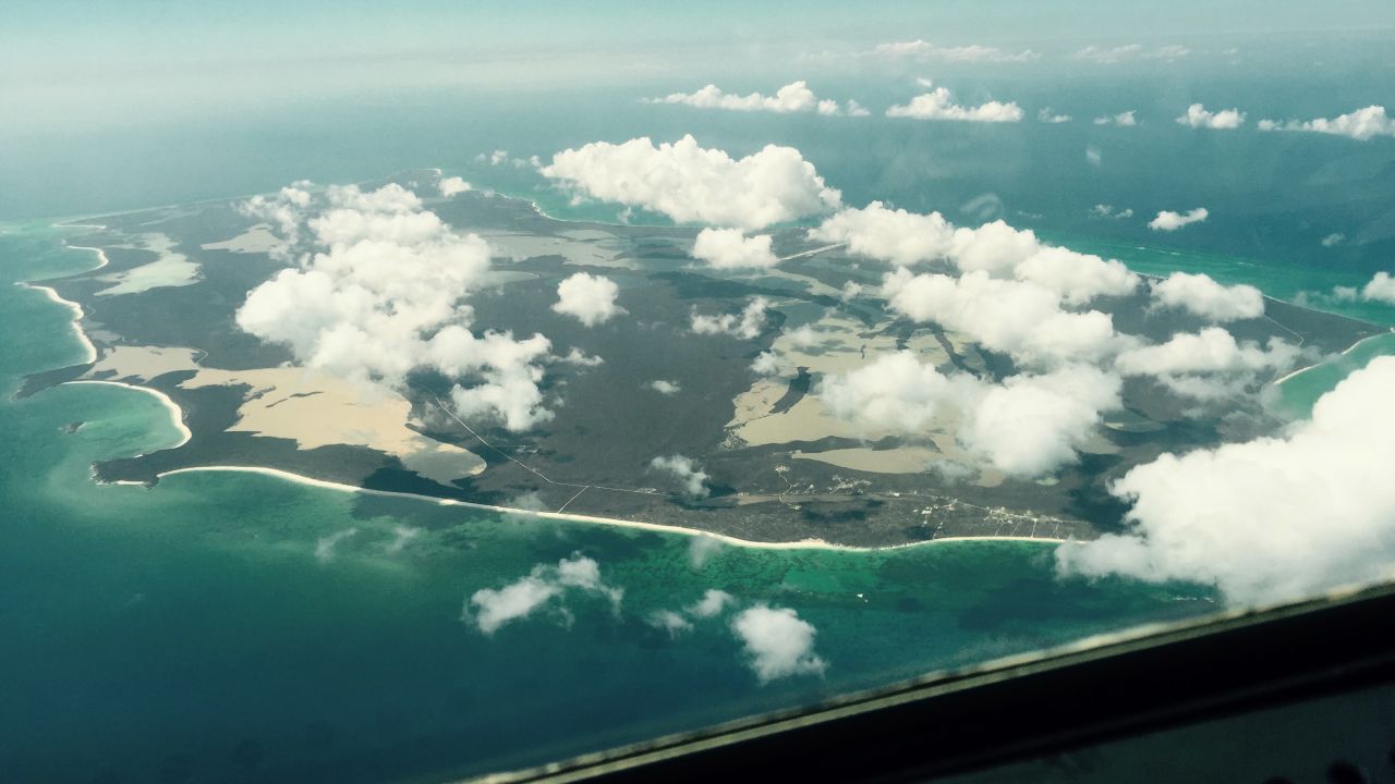The HC-130 passes back over San Salvador Island, Bahamas, on its way back to the base in Clearwater, Florida. The starting point for the more than 1,000-square-mile search Monday was just northeast of San Salvador Island, in the Atlantic Ocean. The Coast Guard announced while this plane was airborne that the search for the actual container ship was over and the focus was now solely on survivors.
