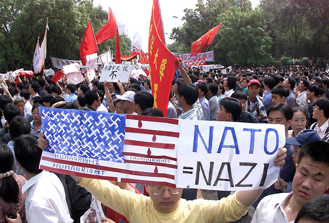A protestor shouts anti-US slogans as thousands of angry Chinese march to the U.S. embassy in Beijing, May 1999 to protest the NATO bombing of the Chinese embassy in Belgrade.