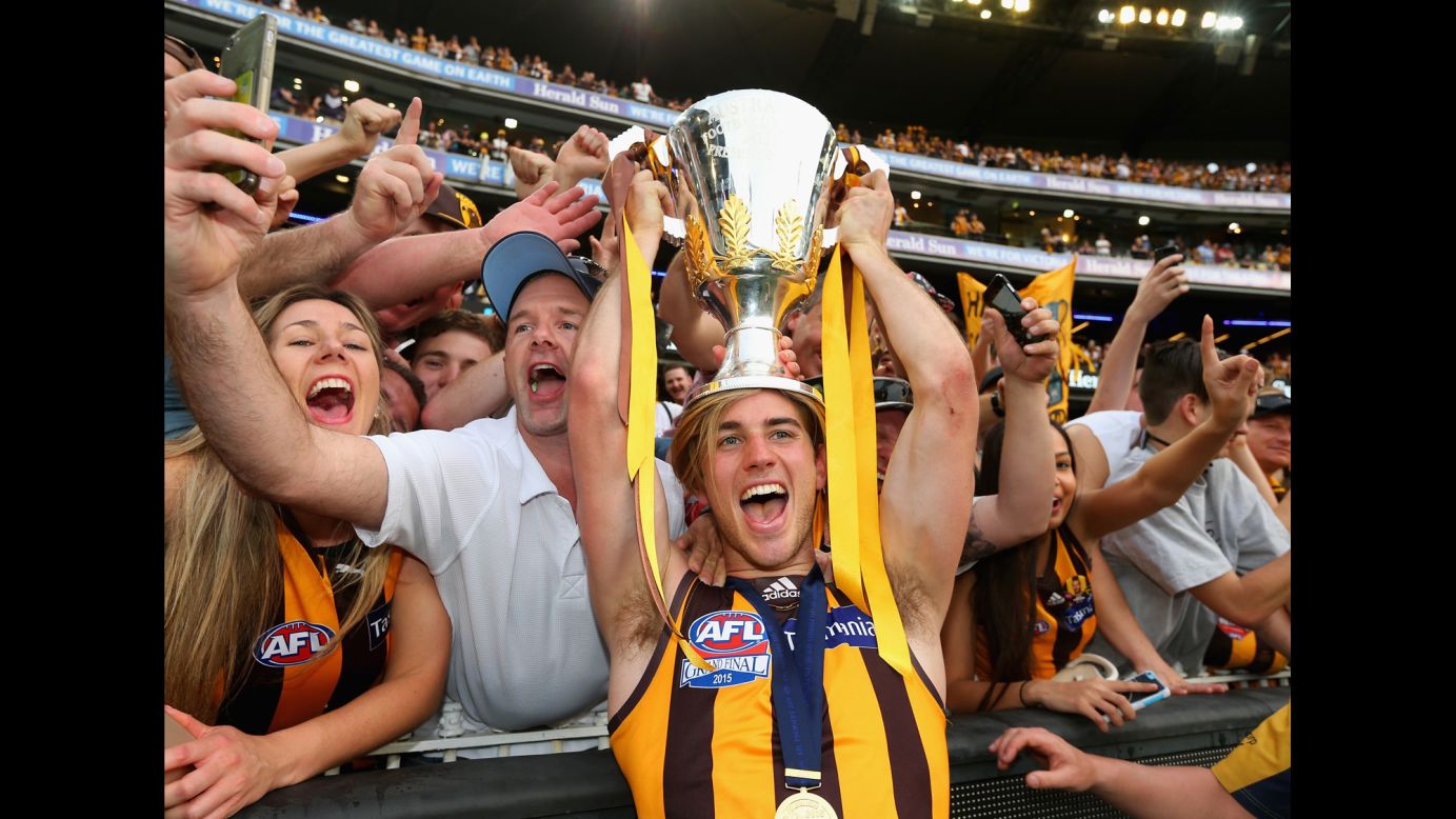 Hemsworth's team, the Hawthorn Hawks, went on to win the final in Melbourne. Here, a fan snaps a selfie next to Hawthorn's Ryan Schoenmakers.
