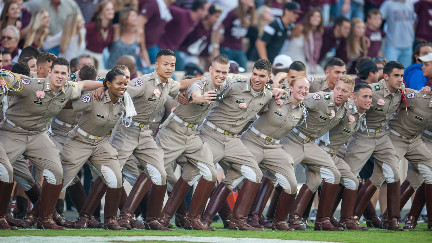 A member of Texas A&M's Corps of Cadets takes a selfie before a football game Saturday, October 3, in College Station, Texas.