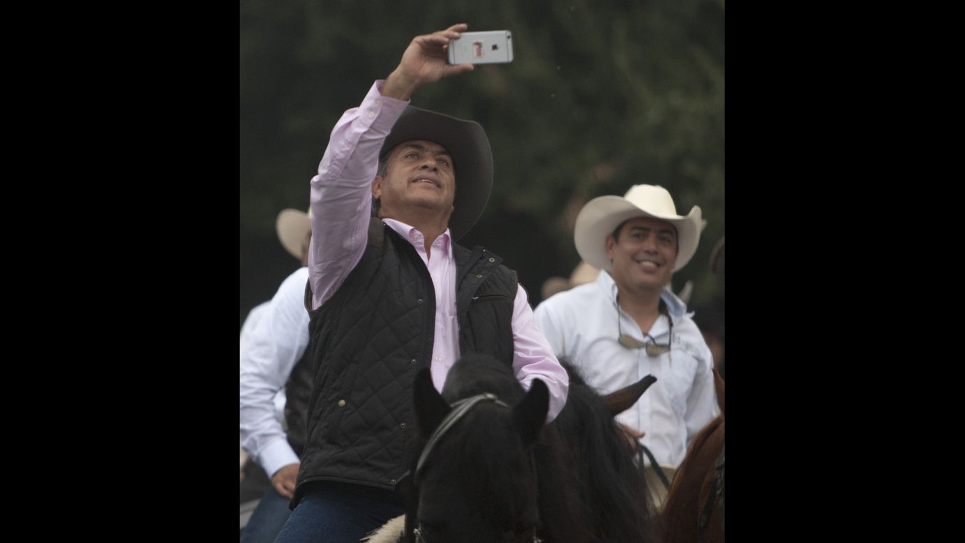Jaime Rodriguez, governor of the Mexican state of Nuevo Leon, rides on a horse during his first day in office Sunday, October 4. Rodriguez's nickname is "El Bronco."