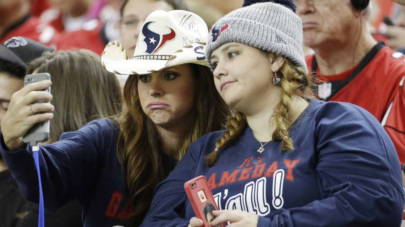 Shanan Malone, left and Hollie Fulsome -- fans of the NFL's Houston Texans -- take a sad selfie during the Texans' game in Atlanta on Sunday, October 4. The Texans were thrashed by the Falcons 48-21.