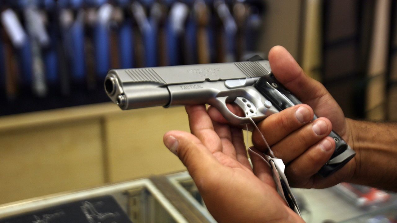 Glendale, UNITED STATES: A man chooses a gun at the Gun Gallery in Glendale, California, 18 April 2007. The massacre at Virginia Tech has ignited fresh talk in the Democratic-led US Congress about tightening US gun laws but it is doubtful enough lawmakers will tackle the politically charged issue. With so many citizens in love with their guns and defensive of their right under the Constitution to keep and bear arms, politicians are reluctant to take on gun owners or the powerful gun lobby.    AFP PHOTO/GABRIEL BOUYS (Photo credit should read GABRIEL BOUYS/AFP/Getty Images)