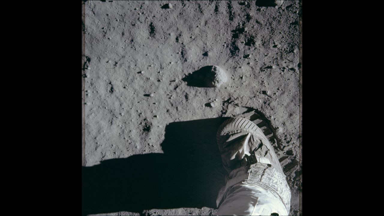 A close-up view of an astronaut's boot on the moon's surface during Apollo 11.
