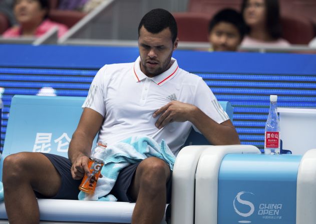 Jo-Wilfried Tsonga of France touches his chest after receiving a medical time out during a match on October 5. Tsonga complained of dizziness and shortness of breath but would not comment on whether he thought the smog was the cause of his problems. 